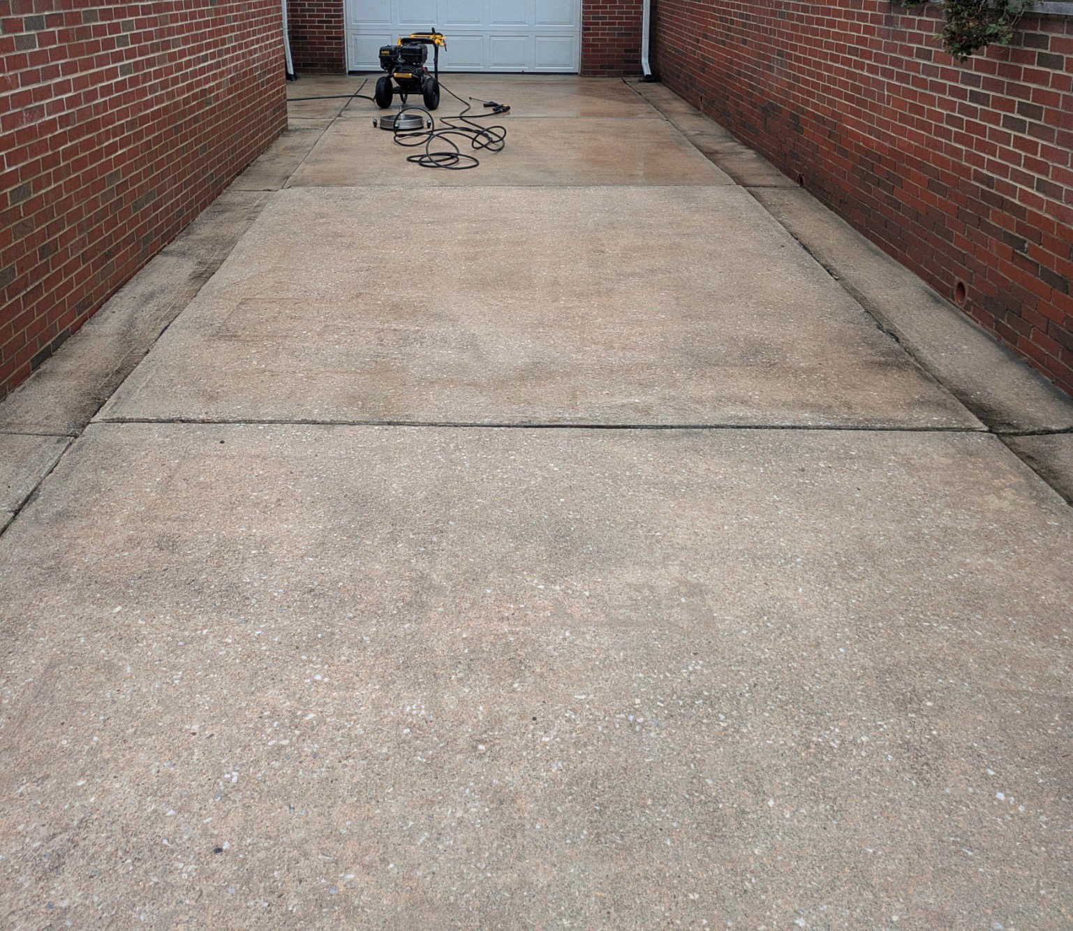 Cleaned concrete driveway after pressure washing
